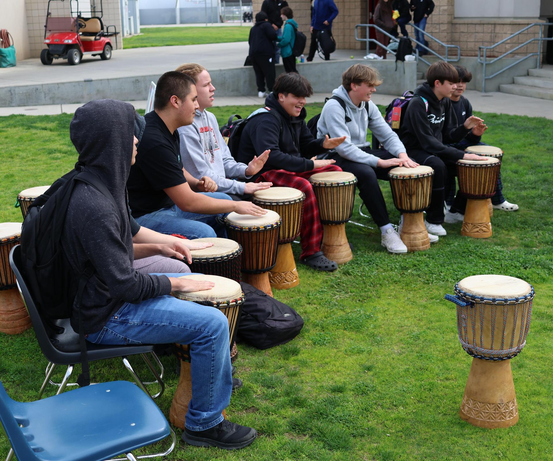 students and staff participating with the African Drum Interactive