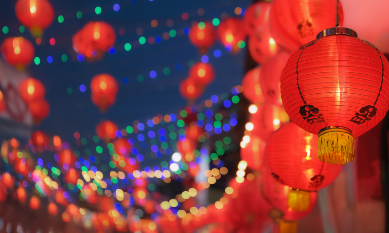 Night sky background with Lunar New Year red lanterns strung artistically