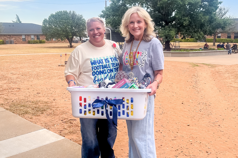 Bennett principal and counselor dropping off donations to Villas in Wolfforth