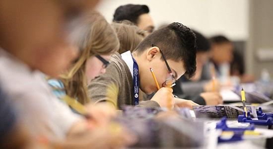 Students showing their science fair certificates