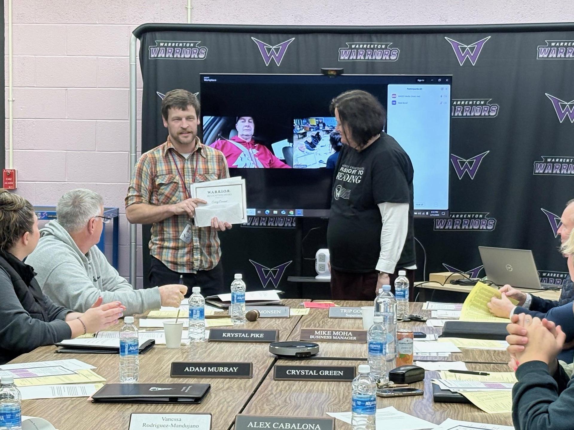 Corey Conant recieving the WARRIOR award.