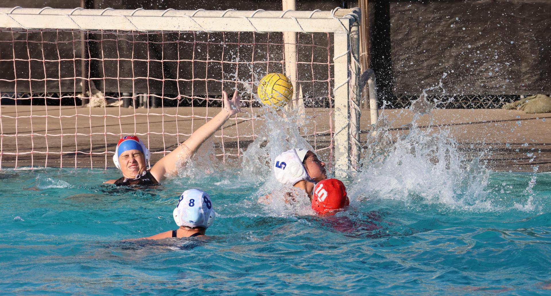 girls playing water polo against Sanger West