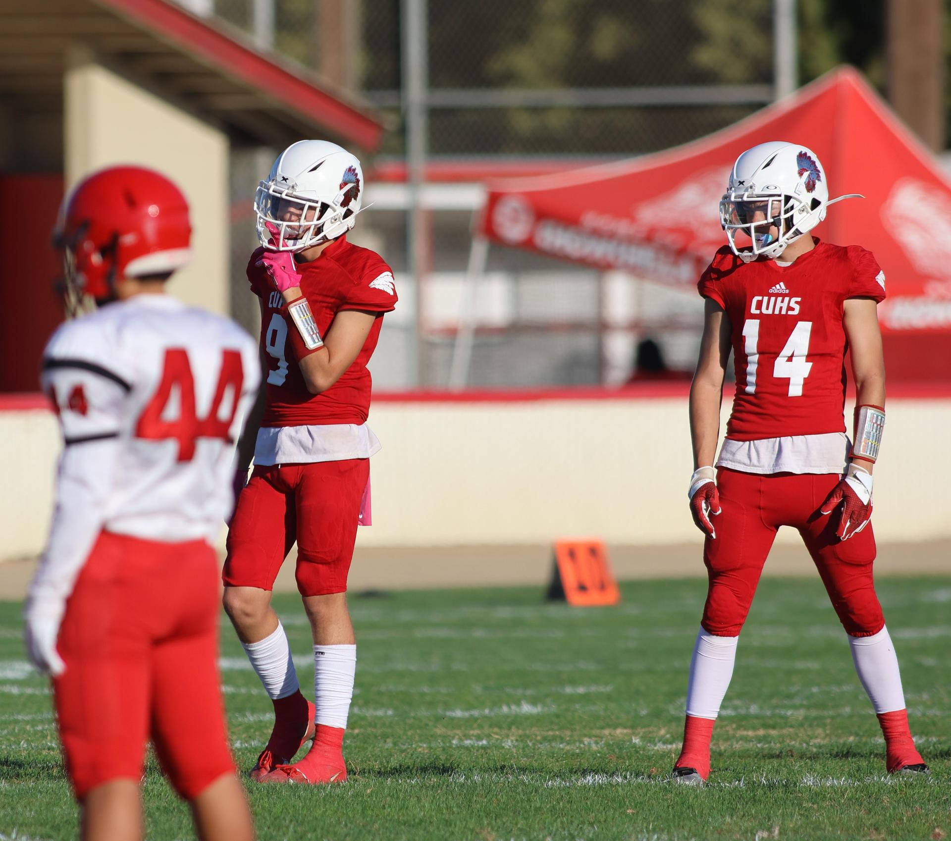 junior varsity football players in action against Fowler