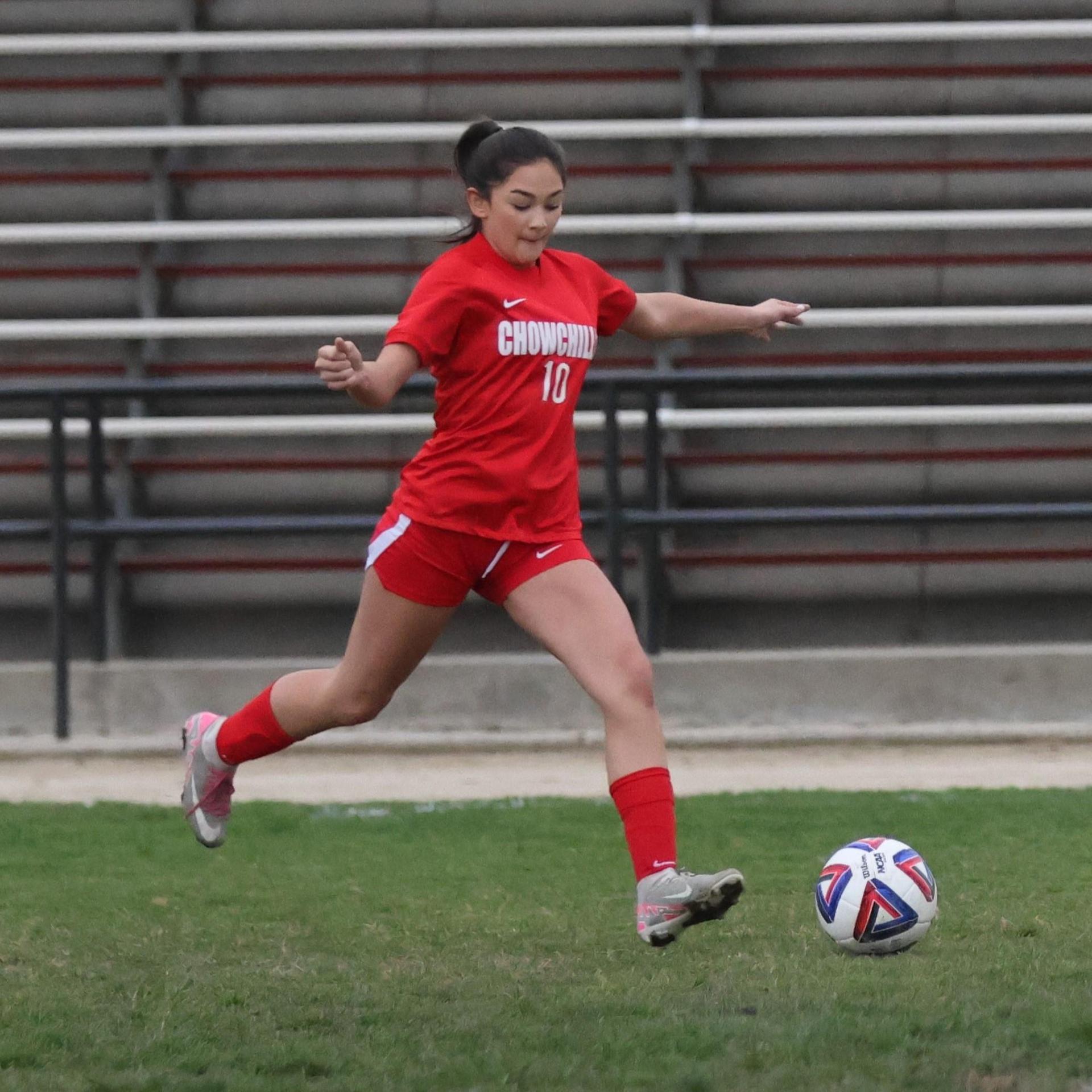 Junior varsity girls playing soccer against liberty