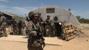 Military squad outside of a bunker
