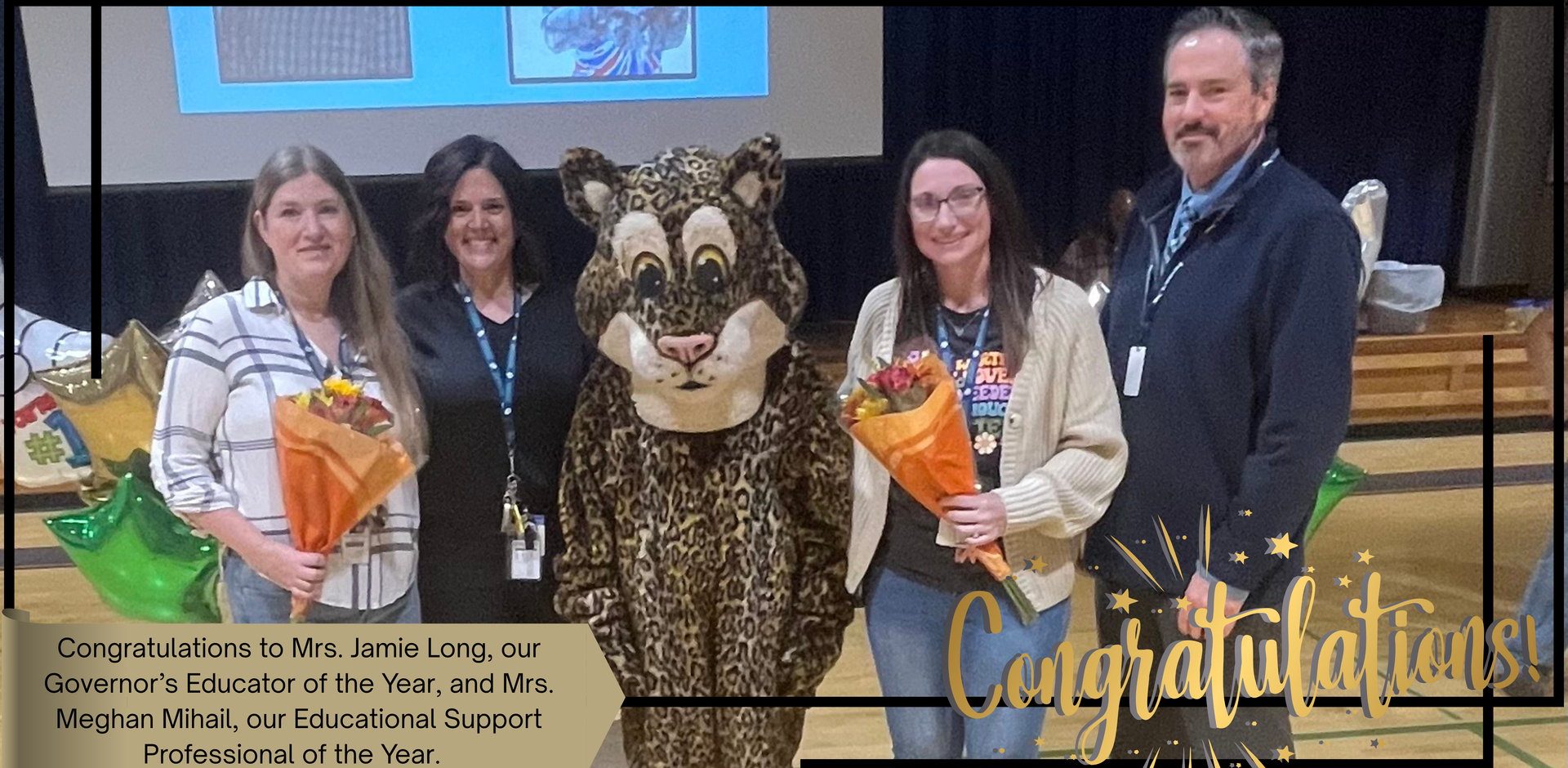 Celebration at a school event with award recipients holding flowers and a mascot.