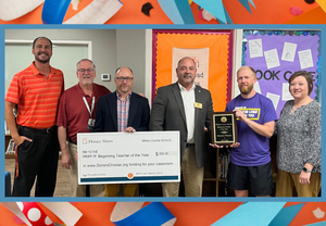 School and Community Leader present Beginning Teacher of the Year award to Brandon Weaver of Mulberry Elementary School.