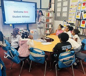 BHS Student sitting with Davis students