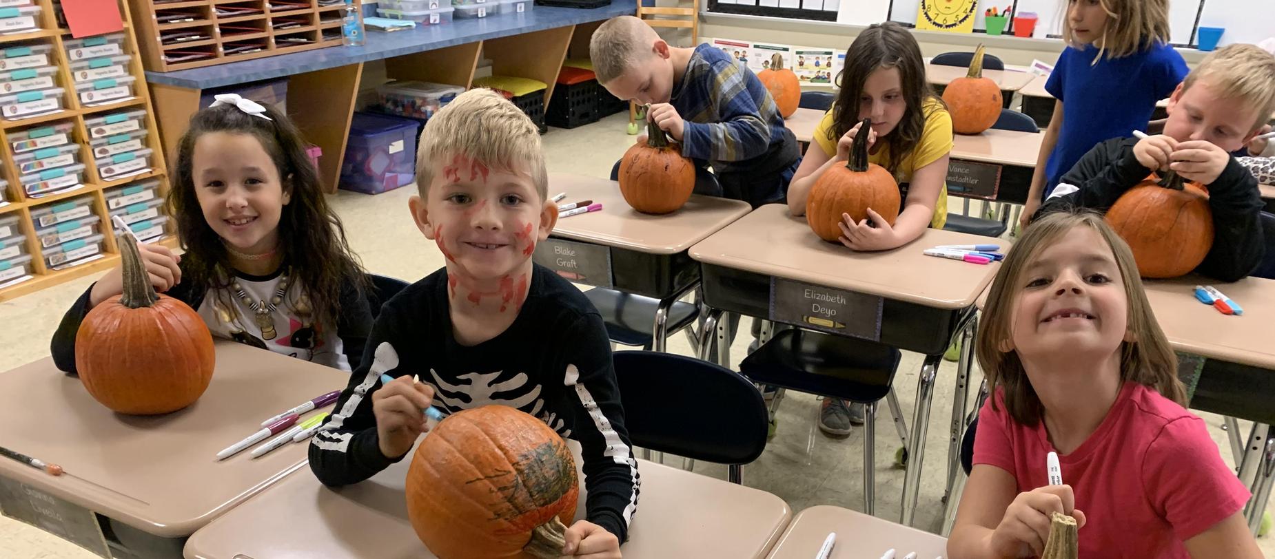 kids coloring pumpkins