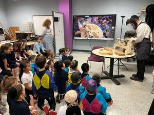 Rabbi Rubin makes a honey dipper.