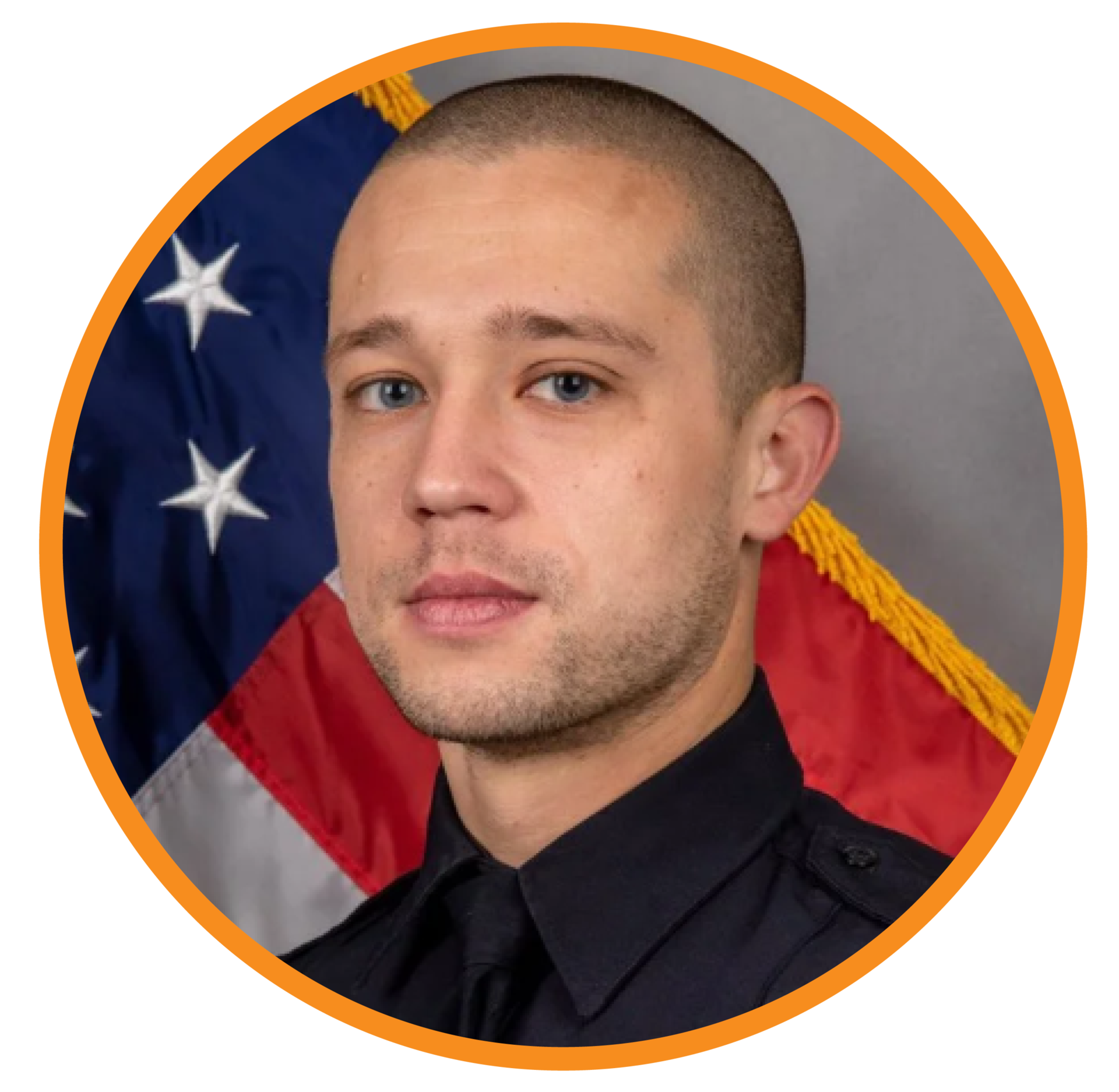 Portrait of a police officer, Michael Callazo, in front of an American flag background.