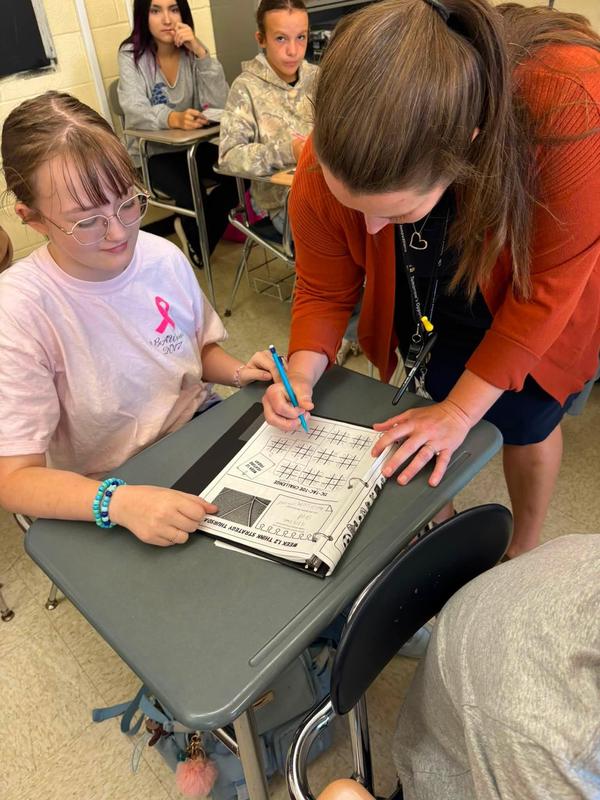 Mrs.Anderson with a student.