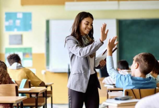 Teacher High-Fiving Student