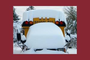 snow buried over bus