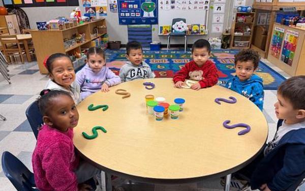 Small group of children working with playdough