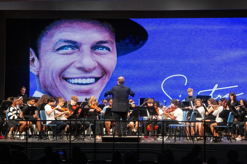 The band and orchestra perform together