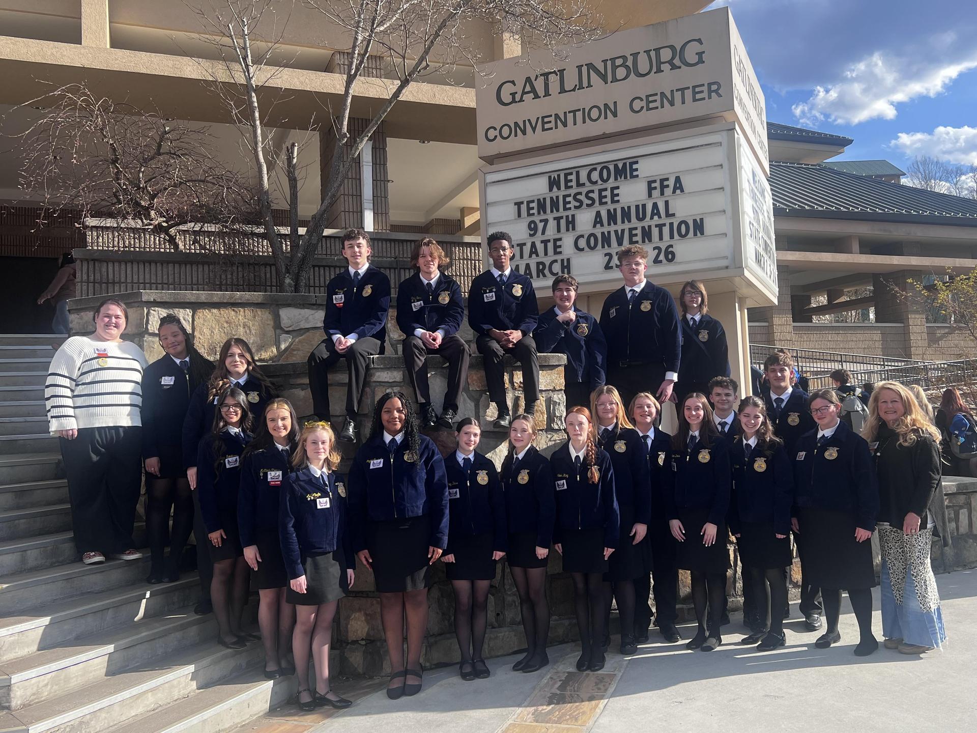 Large group of students in FFA official dress posing outside of the Tennessee FFA State Convention
