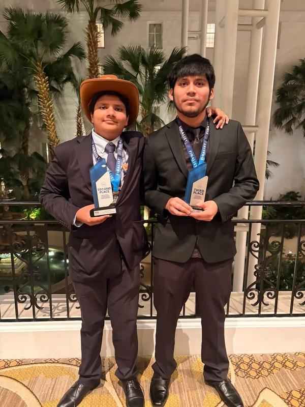 Atharv Garg and Carlos Gamez pose with their trophies
