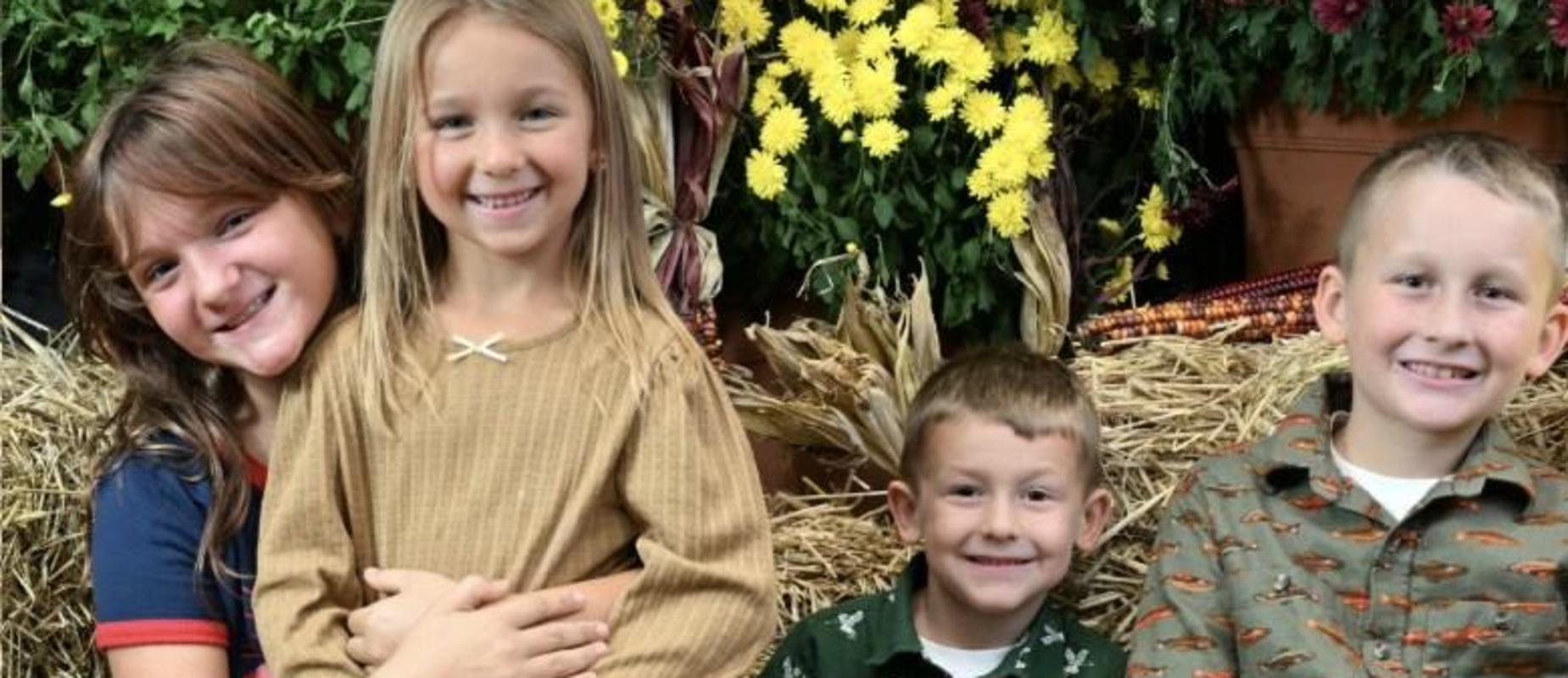 Elementayr Picture Day - siblings with hay bales, mums and umpkins