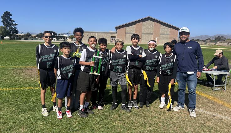 Flag football team picture with 1st place trophy