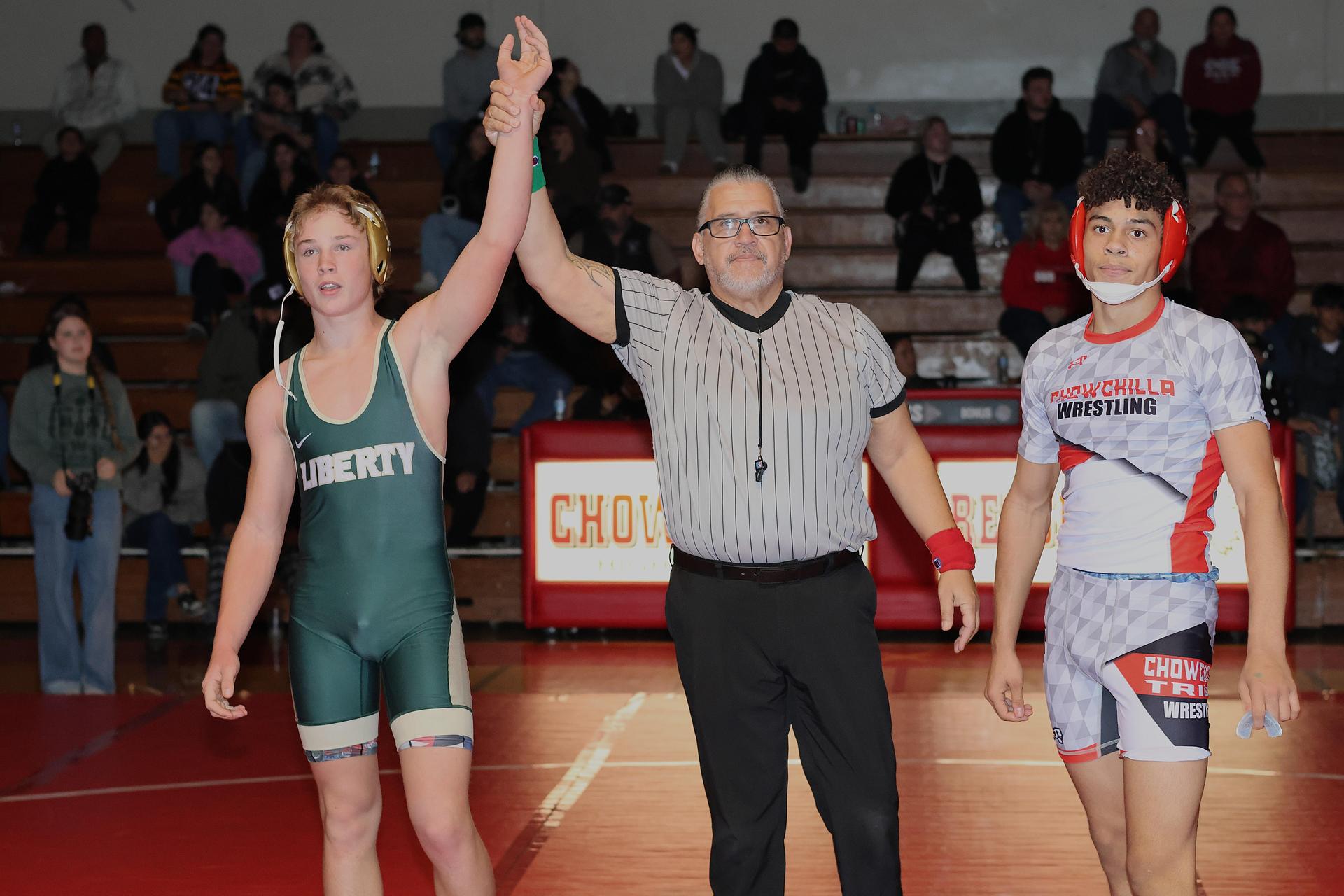 Wrestling winners with hands up 92