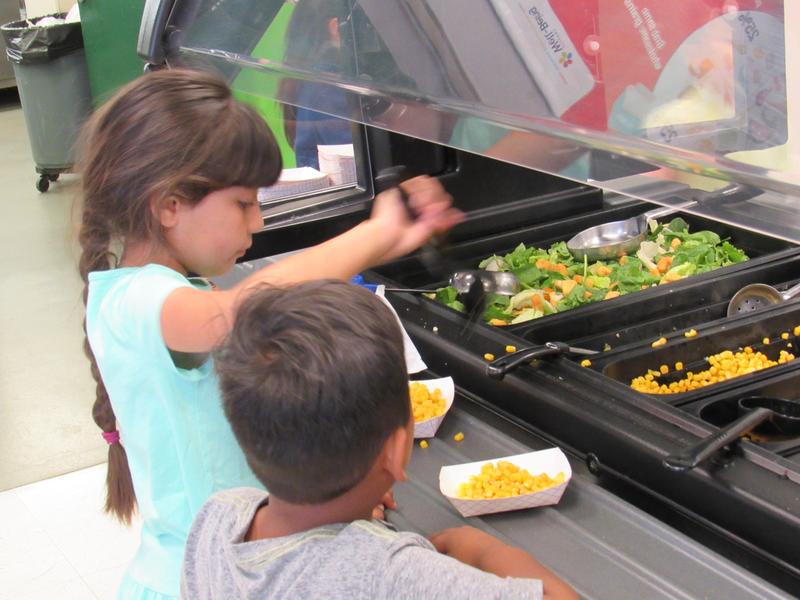 Child serving themselves food