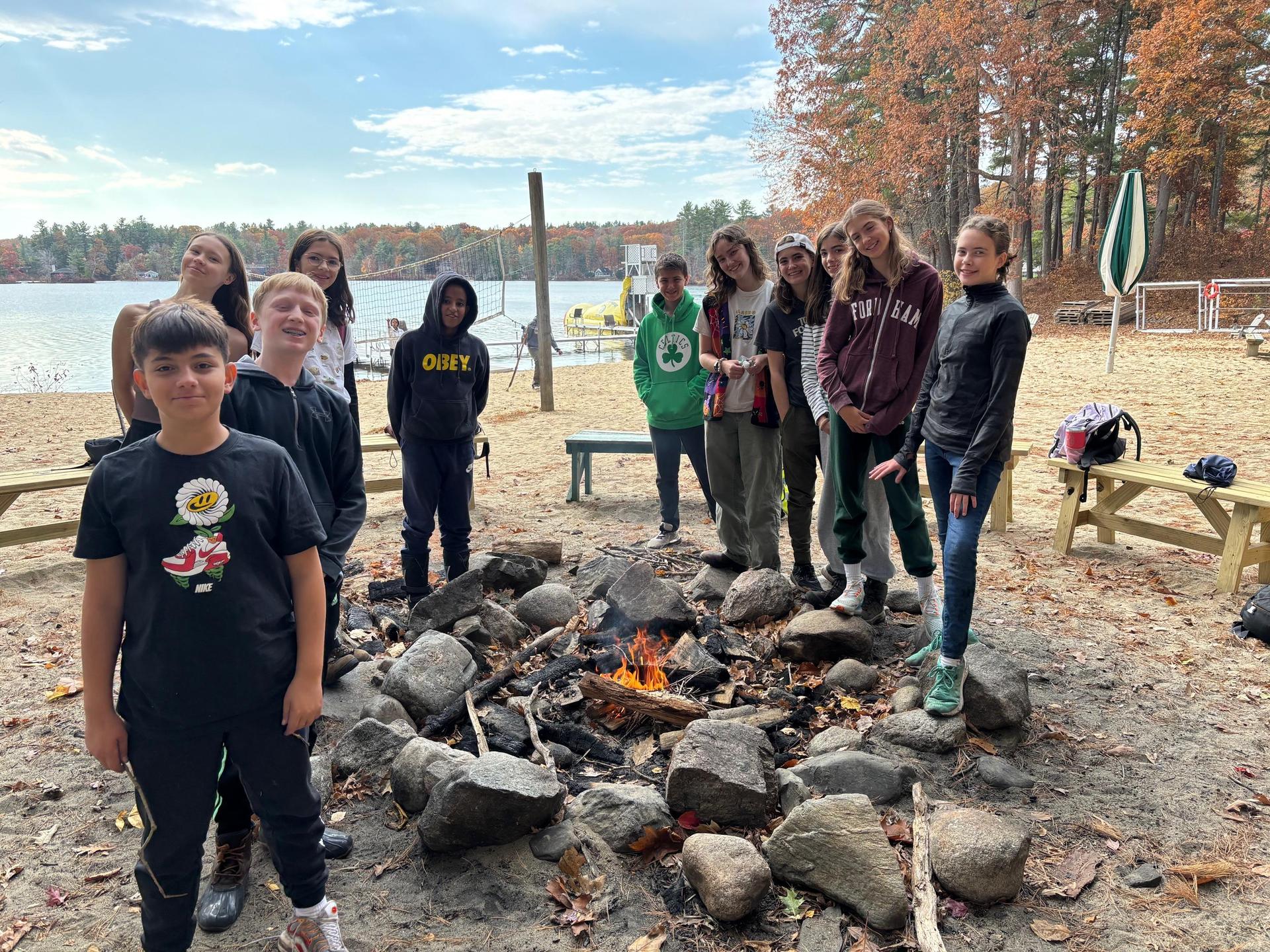 Students in front of a fire pit while at Nature's Classroom