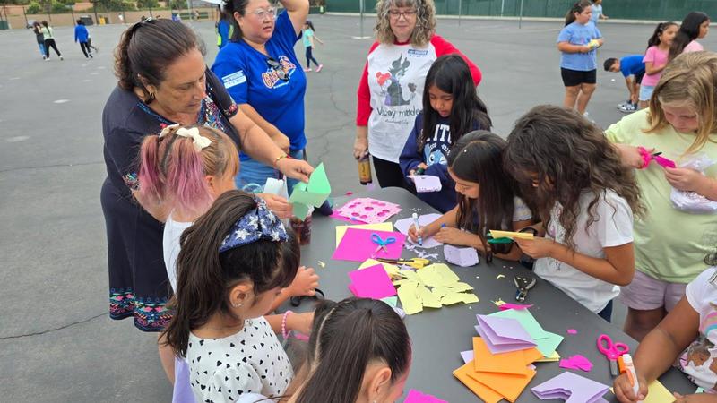students are cutting papers for hispanic month