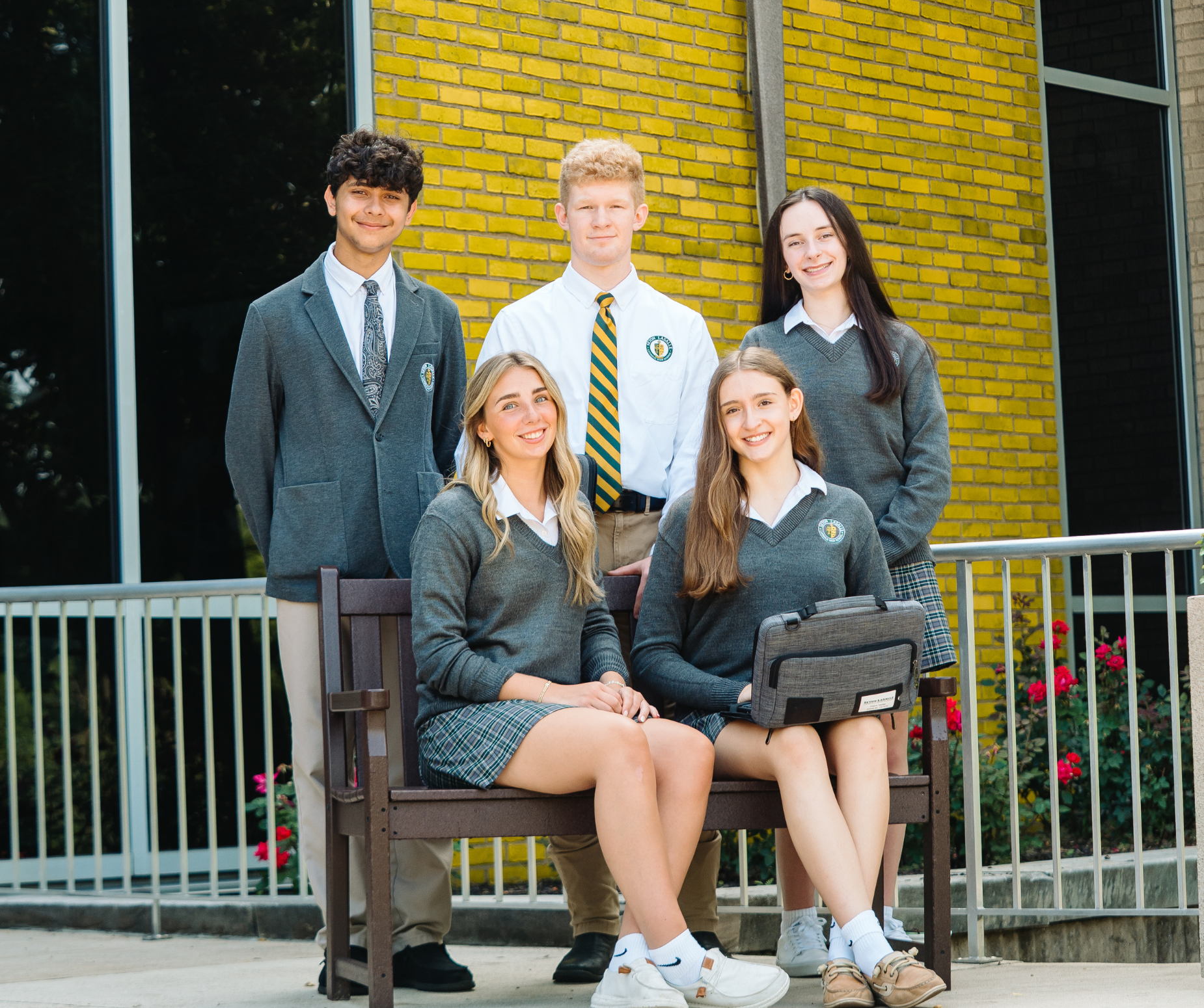 Students hanging out in front of the school