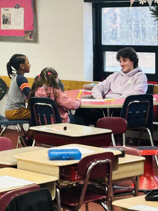 BHS Student sitting with Davis students