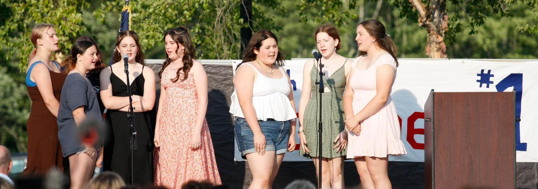 Students outside singing