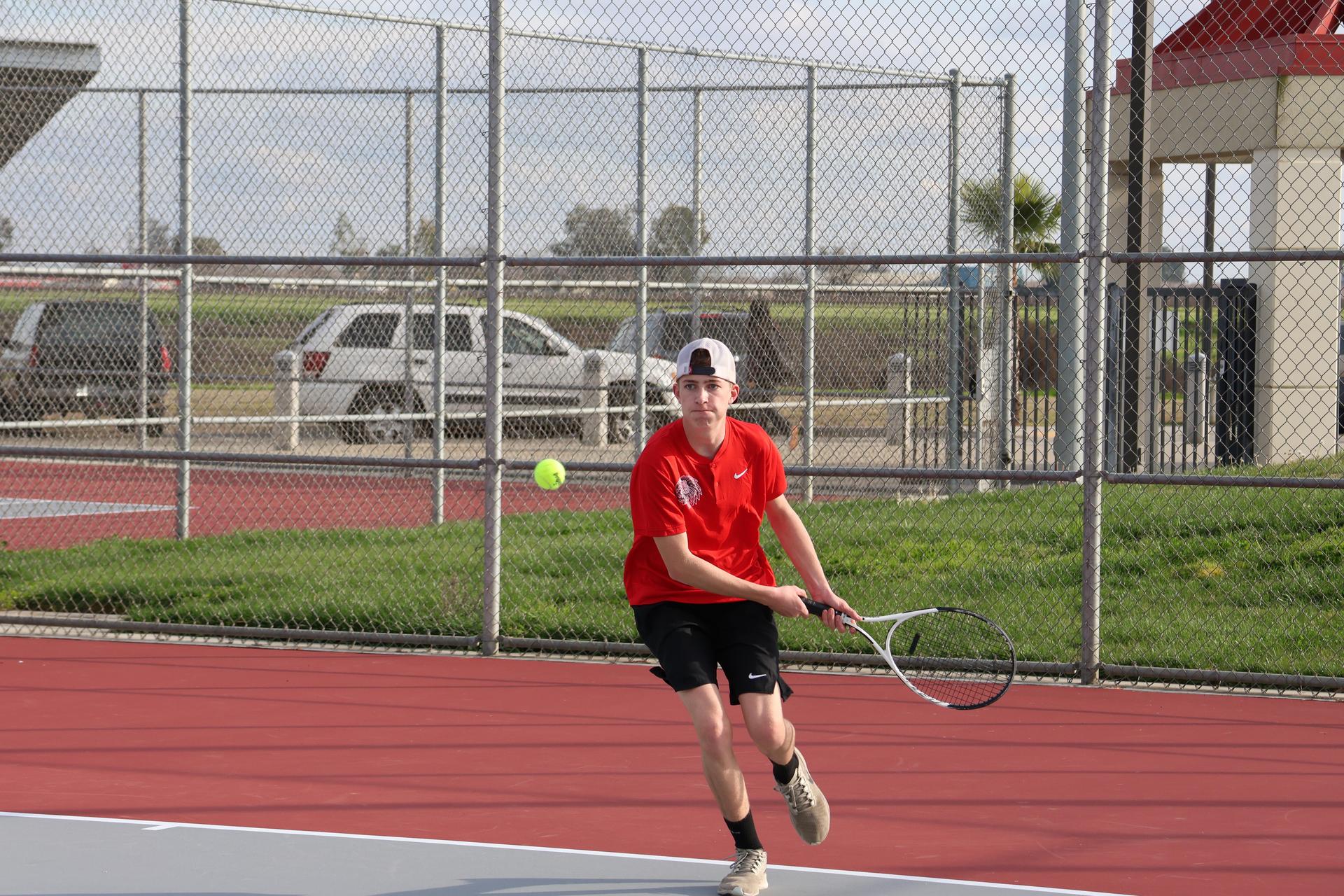 CUHS Boys playing tennis against coalinga