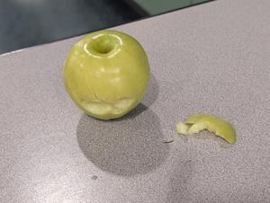 Bitten apple left on table