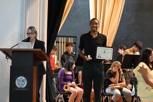 DeWaylon accepting an award for State.