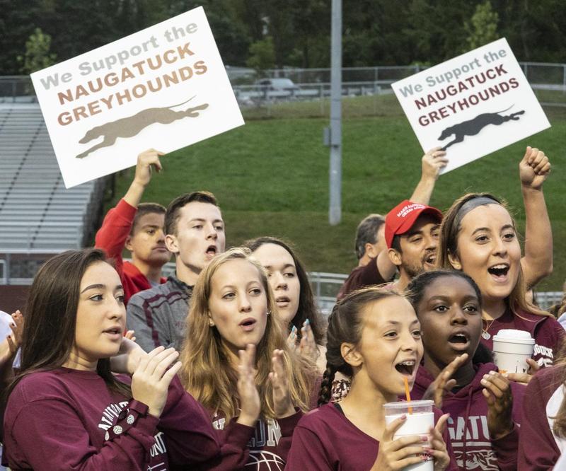Students cheering and holding