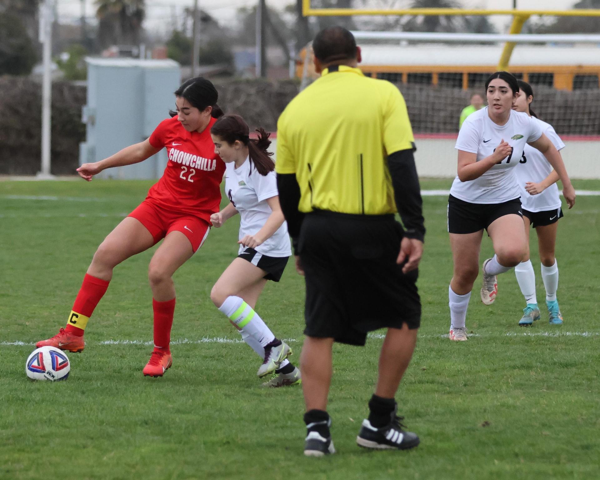 Junior varsity girls playing soccer against liberty