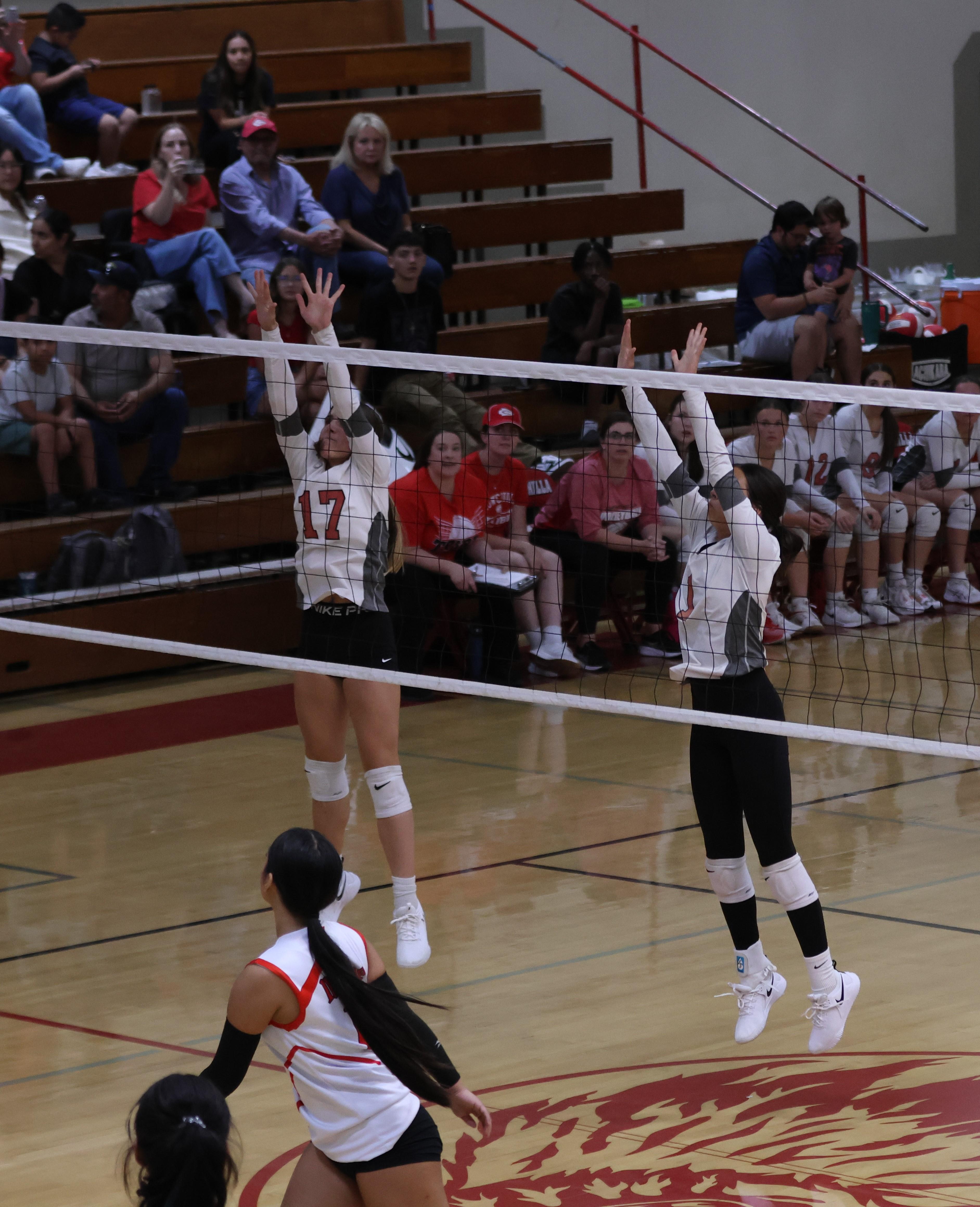 junior varsity girls playing volleyball 113