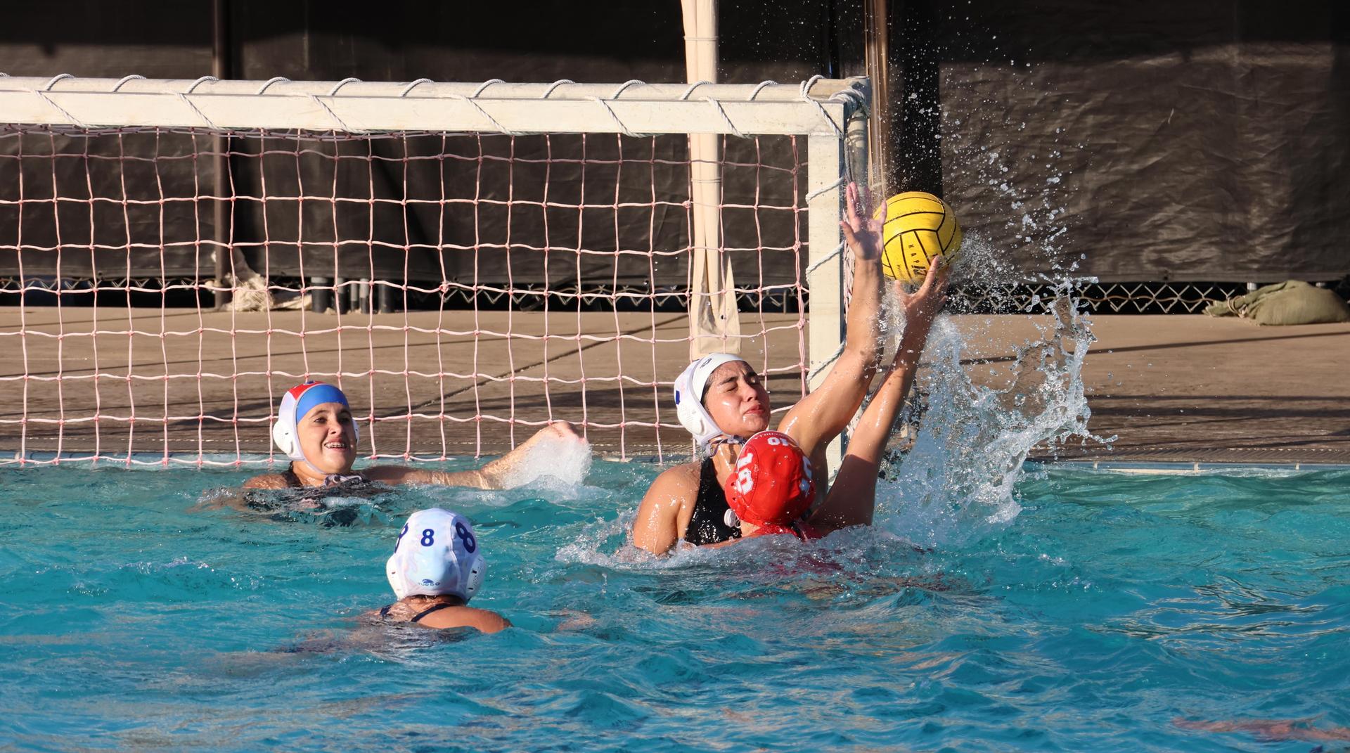 girls playing water polo against Sanger West