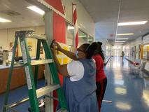 Students working on Christmas door decorations