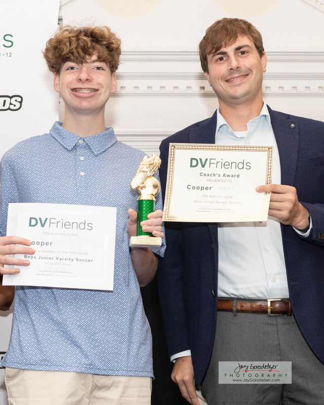 Student Receiving award from Coach