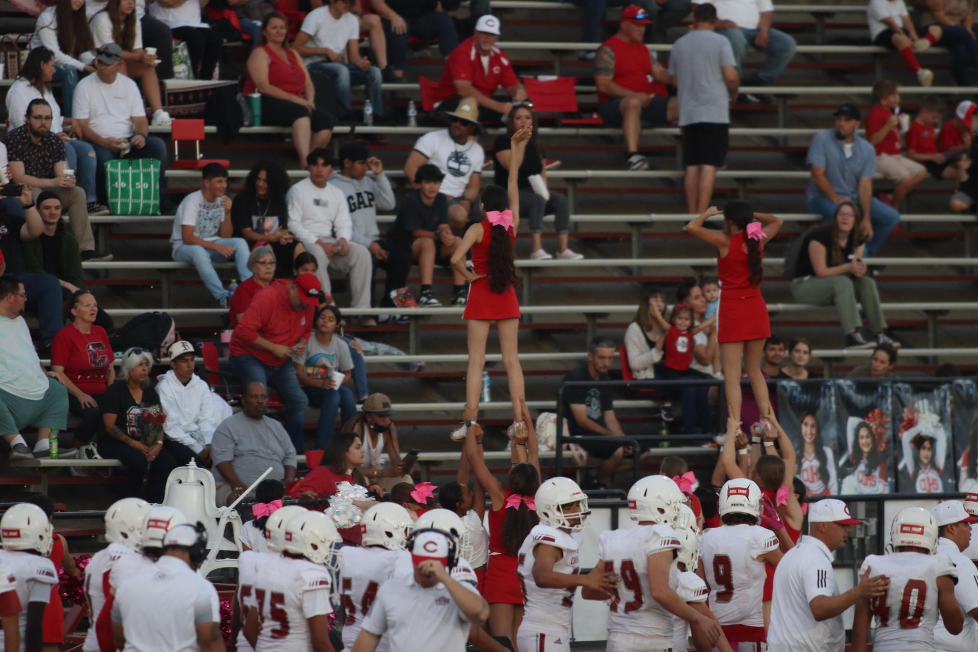 Junior Varsity football players in action against Caruthers