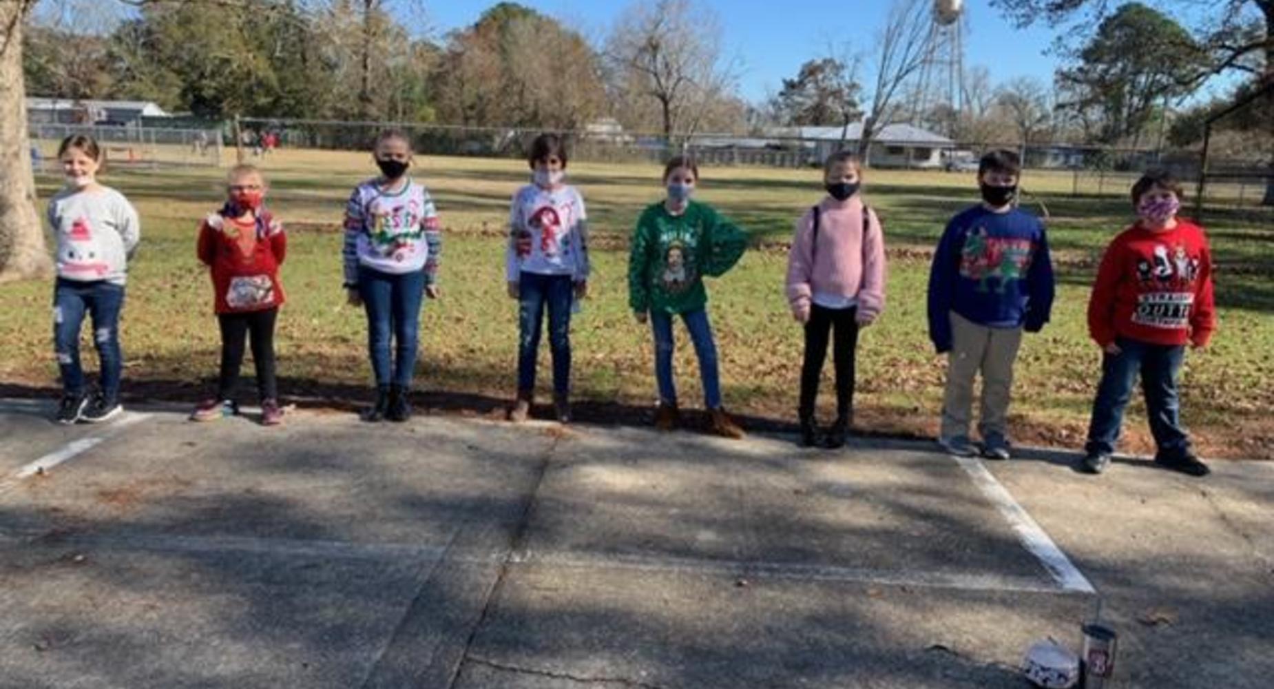 4th grade students in ugly Christmas Sweaters