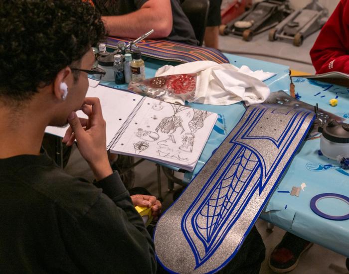 Students design and airbrush skateboards