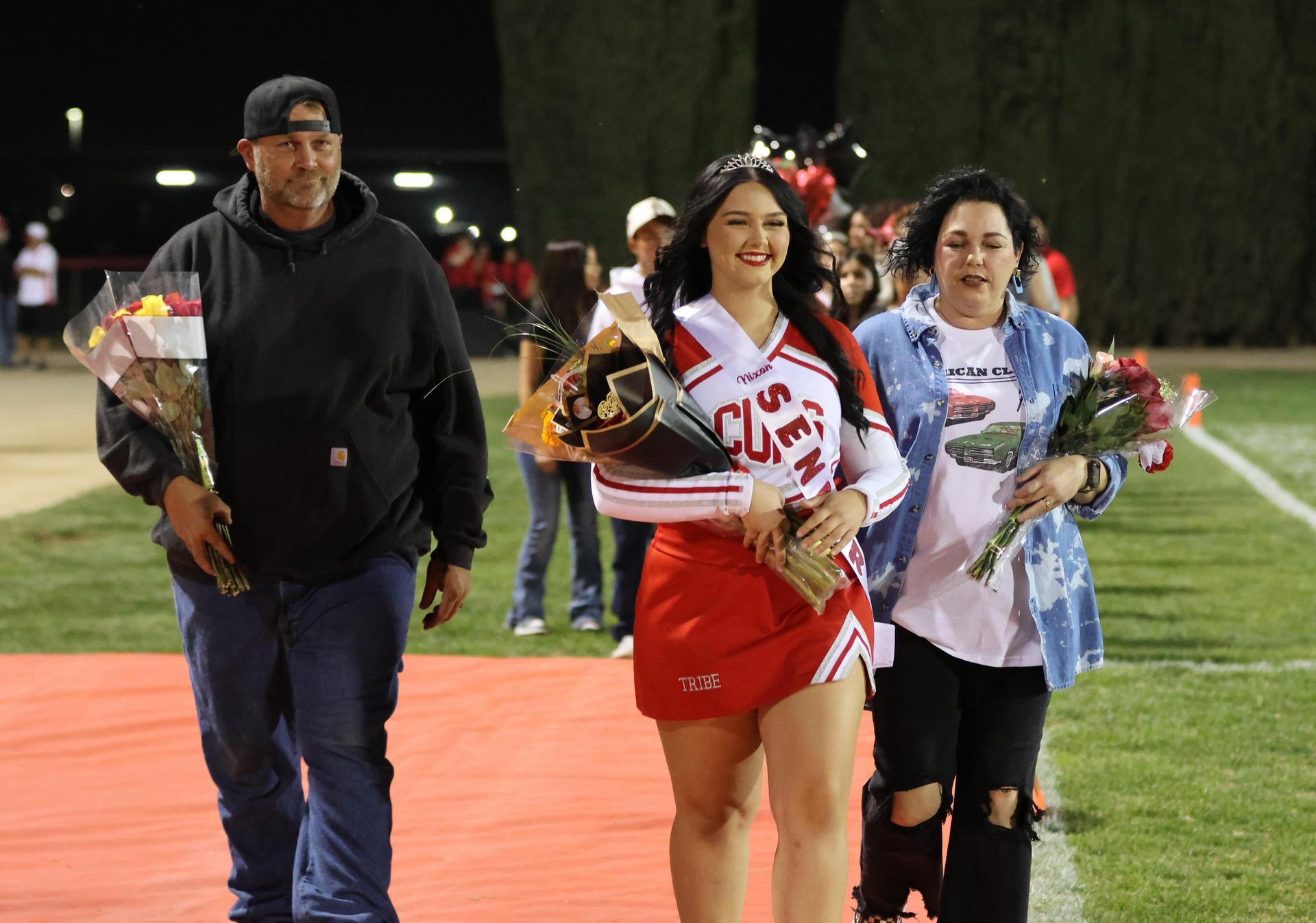 seniors and their escorts celebrating senior night