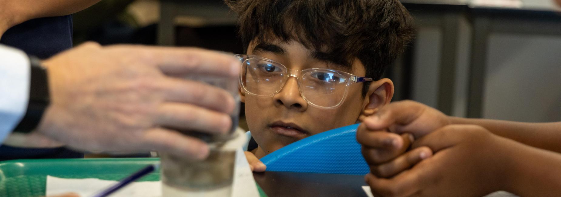 A student watches an experiment