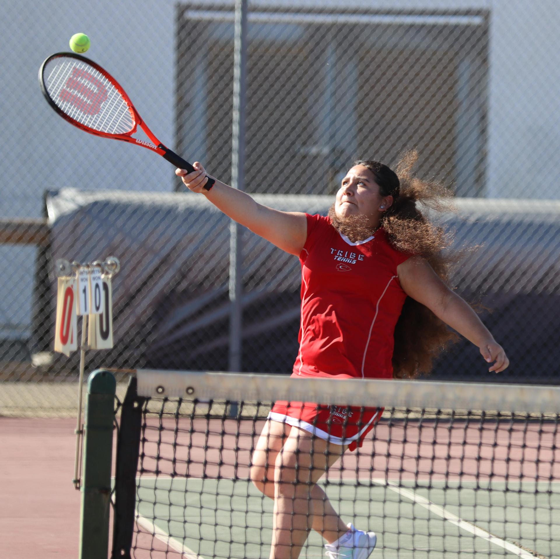 girls playing tennis against Golden Valley