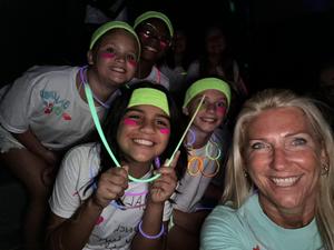 Students and staff at a glow in the dark fun run.