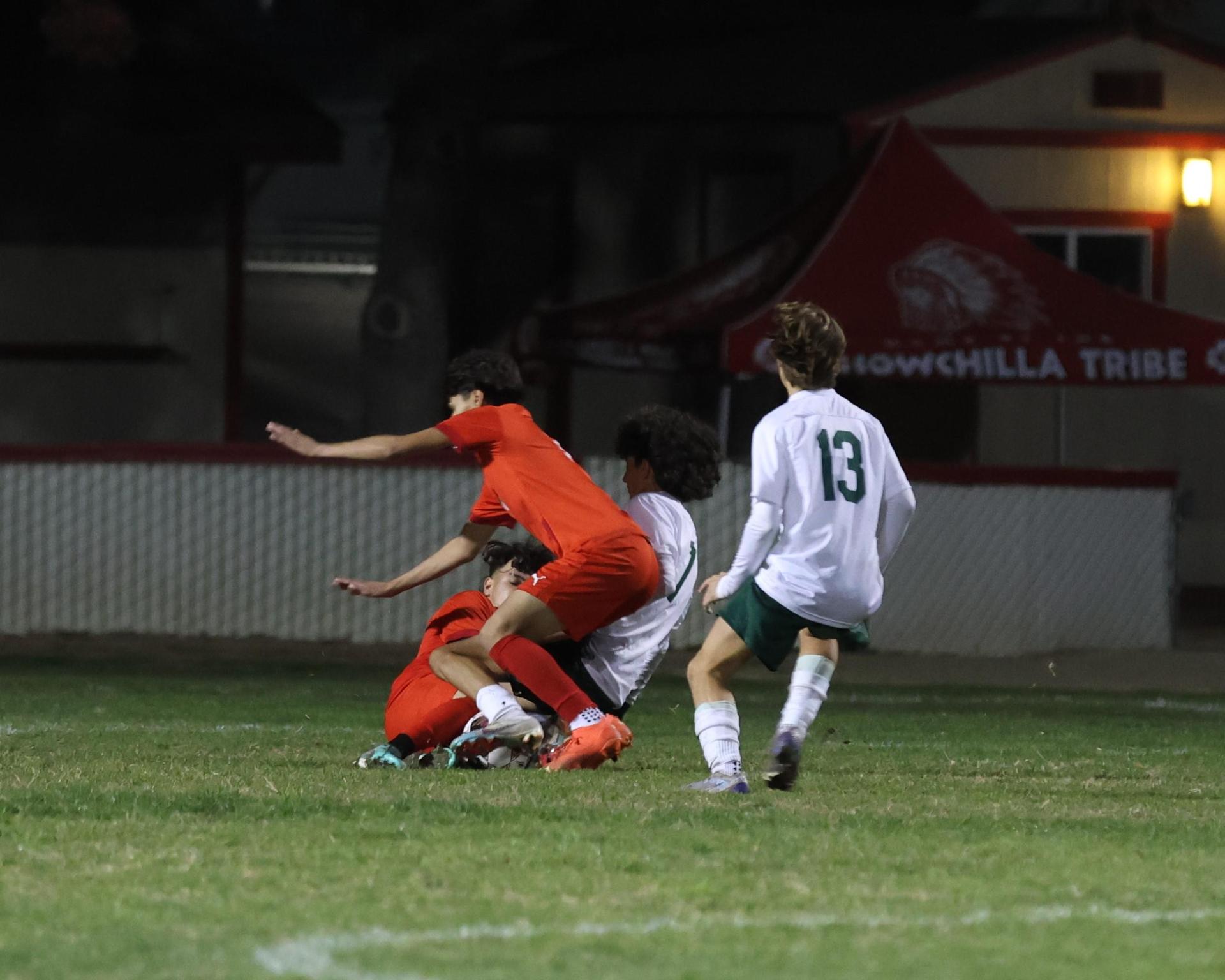 Varsity boys play soccer against Kingsburg