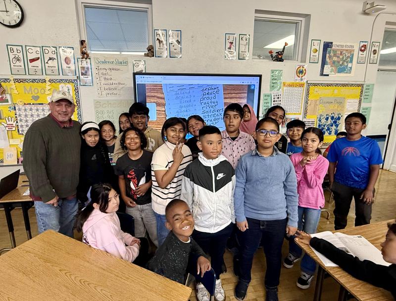 Students and their teacher at a classroom