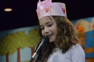 A girl saying her part during the chumash play